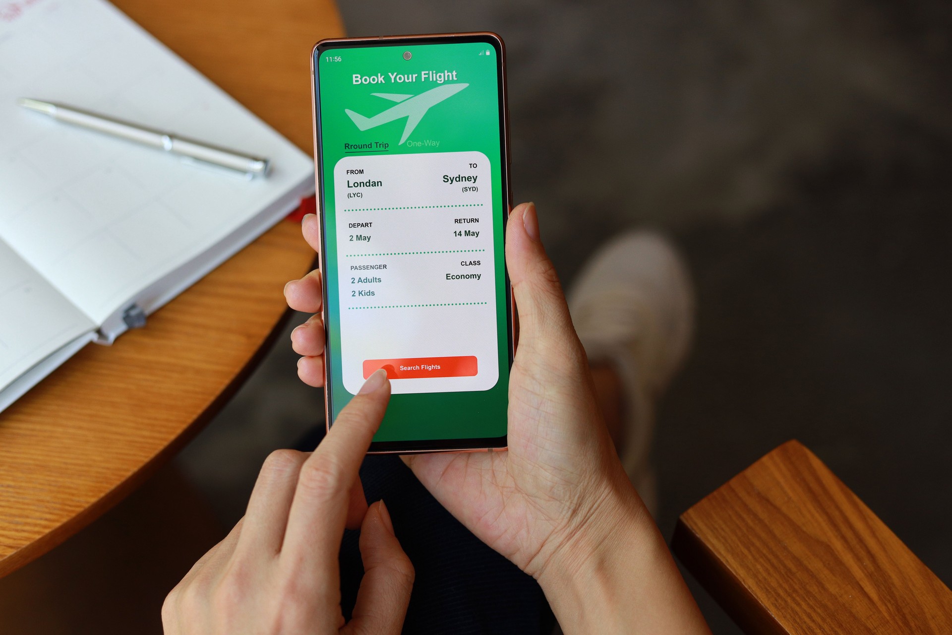 Woman using smartphone to book flight tickets and plan holiday